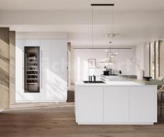 Cuisine chic en L blanc mat minimaliste avec cave à vin réfrigérée intégré encastré